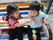 A cute moment of Tran Dong Hy, Kindy 6 of UK Academy Hue and her new friend at Belem orphanage.